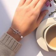 تصویر دستبند استیل شاخه و مروارید